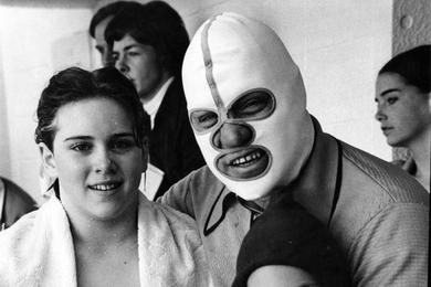 Meet record breaker Sean Lille and Mona Beyer get a congratulatory but gentle hug from Mona's father, wrestling's famed "Destroyer."