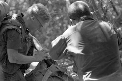 Two unidentified Marines of the 2nd Battalion, 1st Regiment, 1st Marine Division inspect some bowls found while on a sweep on Go Noi Island, 10 miles south of Da Nang and five miles inland from Hoi An.