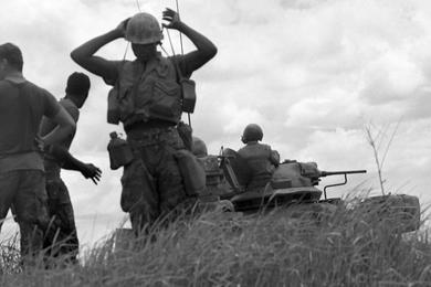 Members of the 2nd Battalion, 1st Regiment, 1st Marine Division take a break during sweep operations on the north side of Go Noi Island.