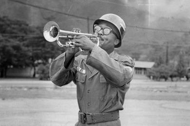 Sgt. Robert S. Blue, alias "Little Boy Blue," blows his horn daily for retreat at Camp Casey, headquarters of the U.S. 7th Inf. Div. in Korea. Blue is a member of the 7th Inf. Div. Band. 