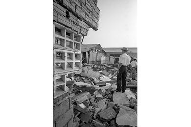 Destruction caused by enemy 122mm rocket that fell short in an attack on Tan Son Nhut Air Base.