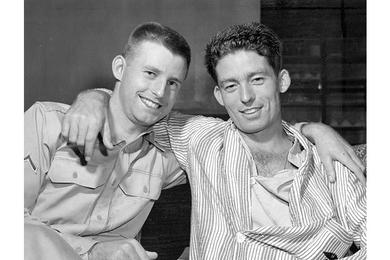 Two brothers meeting for the first time in two and a half years embrace each other at the 8167th Army Hospital in Tokyo.