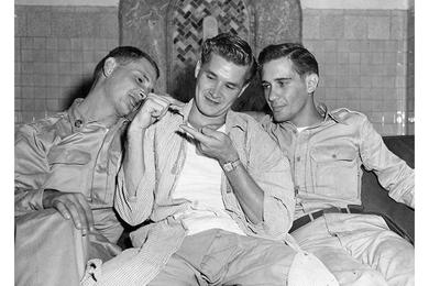 "I SHRUNK" - Ex-PW Sgt. Randsdell P. Le Blanc (center) shows his brothers, Pvt Ames J. Le Blanc (left) and A/2C Wilton K. Le Blanc, how much smaller he is. The brothers from Port Arthur, Tex., met for the first tie in six year when Ransdell was released this week from a Communist prison camp.