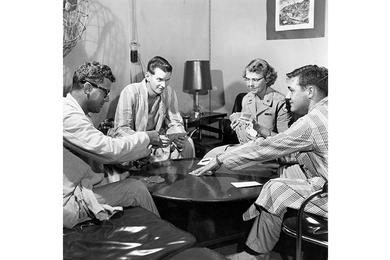 Betsy Denman, of Red Cross, joins card game in hospital's Red Cross Section. The 121st Evacuation Hospital in South Korea