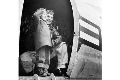 A Farewell Salute is given to the men of the 665th Med. Dep. who have cared for him the past six months, by Johnny Kim Suderman, 5-year-old Korean orphan.