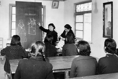 Stitch in time - Young girls of the Eden Widow's Home project take sewing lessons in a small classroom at Chunho village, near Seoul.