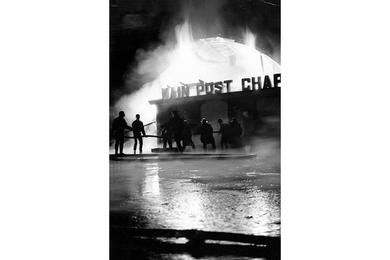 Firemen battle flames that destroyed the Main Post Chapel on Yongsan Compound in Seoul on Christmas night.