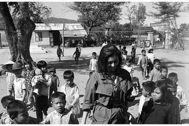 Linda Giese of San Mateo, California is a big hit with the children of Phu Loc. Mrs. Giese is in country to visit the 1st Battalion, 327th Infantry Regiment, 101st Airborne Division near Phu Loc, Vietnam.