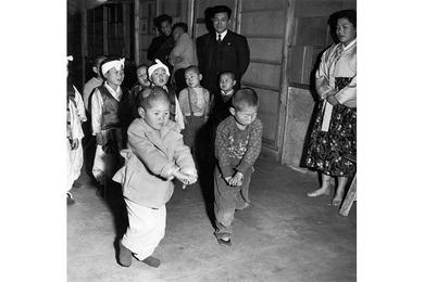 Two boys of the Angels Home in Seoul take part in a dance during one of the dancing classes.