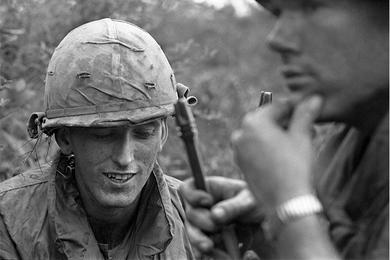 SP/4 Steve Turner (St. Petersburg, FL) from B Troop, 1st Squad, 1st Cavalry Regiment talks to Sgt. Kenneth Bouche (Anaheim, CA).
