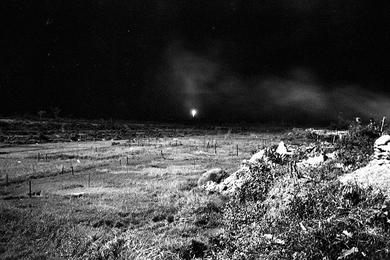 Illumination rounds fall outside perimeter at LZ Ross as tracers, fired during "mad minute", are fired in all directions.