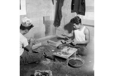 Standing Wood and applying a special plaster, these older orphans of the Seoul Police and Soliders Orphanage are learning lacquerware manufacture, a centuries-old profession for which there is still a ready market today.