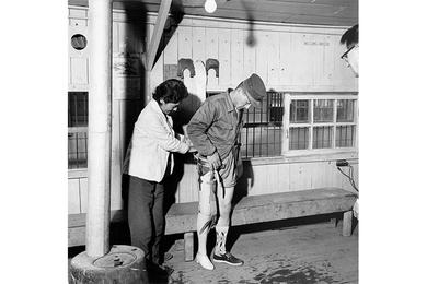 NEW ARTIFICIAL LEG is fitted to a disabled veteran of the Korean war by Dr. Chung Hie Oh at the National Rehabilitation Center in Pusan.