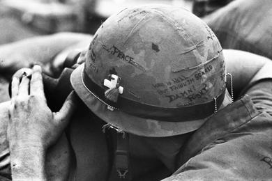 A U.S. Marine's helmet tells a story during the prolonged assault by Viet Cong forces on the base at Khe Sanh.