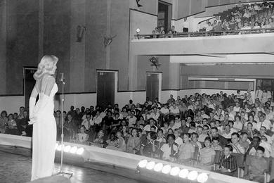 There is nothing like a blonde, or so the song goes, and singers Sally Jo Knowles isn't getting any arguments from servicemen in the audience at the new U.S. Armed Forces Theater in Saigon.