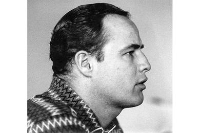 Actor Marlon Brando is interviewed by a Stars and Stripes reporter during the filming of the Warner Bros. film, "Sayonara."