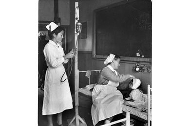 Tender care - These little children of misfortune are lucky in having the attention of skilled medical attendants.