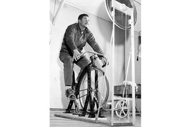LEGS ARE STRENGTHENED by PFC Belte Hailu, an Ethiopian from the U.N. compound, who works out on a bicycle exerciser at the 48th Surgical Hospital. 