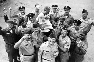 KOREA-Men of the U.S. Army Advisory Group, Korea (KMAG) and the Seoul Area Command hoist Il Sung Park on their shoulders in a victory celebration.
