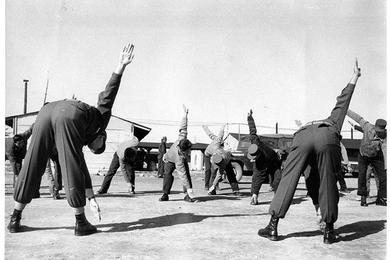 RECONDITIONING EXERCISES are led by SP5 Wallace C. Henninger, chief ward master, and SFC Harold Kelleher, training NCO.