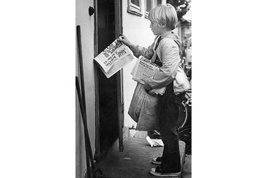 John Honke delivers paper to subscribers. Through it all, delivering the news has been what Stripes is all about.