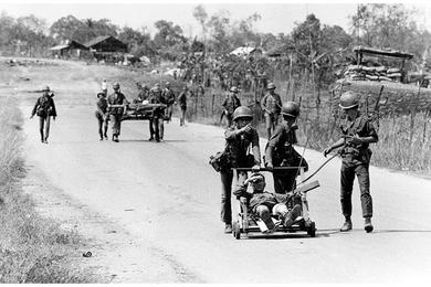 South Vietnamese casualties are hurried down Route 13 - once known as Thunder Road.