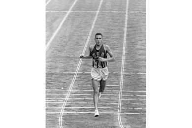 U.S. Marine Corps  Lt. Billy Mills comes in 14th in the Olympic marathon.