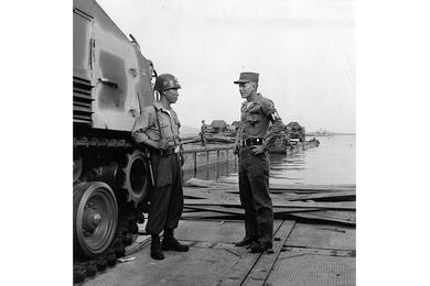PFC Bobby Rutherford chats with Korean security guard.