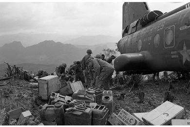 A Marine helicopter lands on the hill landing zone (LZ) to bring supplies and evacuate the wounded.