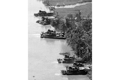 Boats are beached near where Americans from the 9th Infantry Division's 2nd Brigade Riverine Force and South Vietnamese from the 5th Vietnamese Marine Battalion battled the Viet Cong along the My Tho River, 65 miles southwest of Saigon.