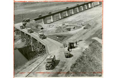A convoy of ambulances carrying sick and wounded prisoners of war cross the Freedom Gate bridge, on their way to freedom and home.