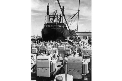 Military supplies for the U.S. Military Assistance Advisory Group, Republic of Vietnam (MAAG) and the South Vietnamese military are offloaded from the freighter Hawaiian Educator February 1962 at the port of Saigon.