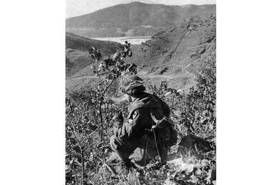 A soldier takes a smoke break.