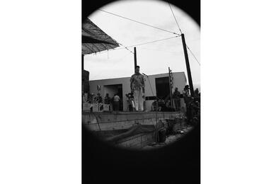 Bob Hope stands solo on stage