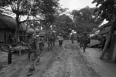Soldiers move through a village north of Chu Lai.
