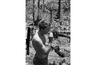 A man brushes his teeth.