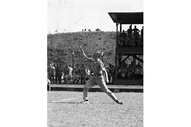 BATON TWIRLER 1st Lt. William E. Modlin, Headquarters, 1st Cav. Div., goes through his paces prior to football game between the Cavaliers and Osan AB on the division's 37th anniversary.