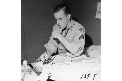 Shel Silverstein, artist (1954-1956), works on drawing cartoons at his desk. Shel Silverstein worked for the Pacific Stars and Stripes as a cartoonist from 1954 - 1956 and drew the cartoon "Take Ten".
