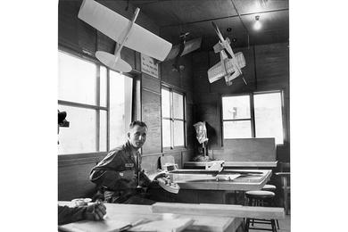 Models of aircraft and boats made by SP4 Karl Breitenstein hang in the recently completed 9th Cav. craft shop. 9/30/1959]; The craft shop is one of the many improvement projects the 1st Recon Squadron has built. The joke in the 1st Reconnaissance Squadron, 9th Cavalry Regiment, 1st Cavalry Division, is that the “recon” in the unit’s name stands for “reconstruction” instead of reconnaissance.” It’s almost true. Since last fall this frontline outfit haws built a steady stream of projects.