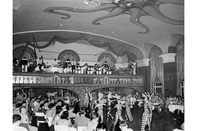 Patrons are requested not to join the floor shows. In the Marine Room a chorus of cuties wiggle the night away while you sip a tall cool drink at ringside.
