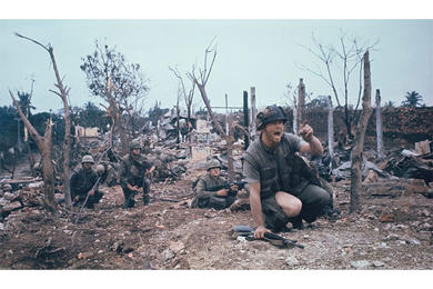 Staff Sgt. Bob Thoms leads his Marines through the city of Hue during the Tet Offensive. Stars and Stripes photographer John Olson's work during Tet — some of it converted to 3D format for access by the blind — is the subject of an exhibition currently on display at the Newseum in Washington, D.C.