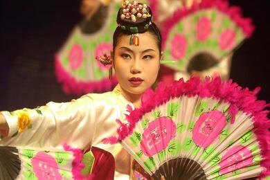 A Korean woman performs a traditional dance