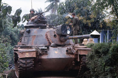 A Patton tank makes its way through the streets of Hue in 1968.