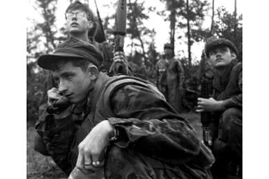 Squad leader Cpl. Mike Roseberry of Paducah, Ky., calls in gunships as Marines from CUPP6, Golf Co., 5th Marine Regiment, and Popular Forces from Huong Xuan Village come under fire near Combat Base Baldy, about 27 miles southeast of Da Nang.