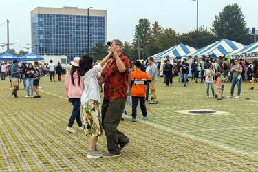 People gather and dance on Balboni Field during the Humphreys Fall Festival at Camp Humphreys, South Korea, Oct. 15, 2022.