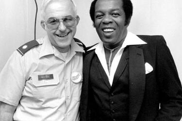 Lou Rawls, right, poses for a photo backstage during the Philippines portion of his 1983 USO tour of the Far East.
