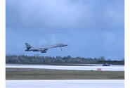 A B-1B Lancer bomber takes off from the runway at Andersen Air Force Base, Guam.