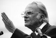 Evangelist Billy Graham conducts a Sunday service at Yokota Air Base in January, 1994.