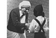 Mother Teresa accepts a gift from a child during her visit to Tokyo in April, 1981.