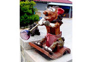 A glassblowing shishi lion, Okinawa’s traditional good fortune sculpture usually placed at the entrance to homes and businesses, greets visitors to the Mid-Air Glass Blowing Studio Rainbow in Yomitan, Okinawa.